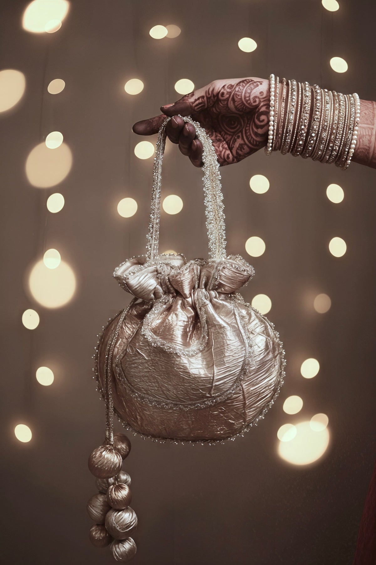 Sarla gold-gota embroidered potli bag with handmade tassels — Ozel