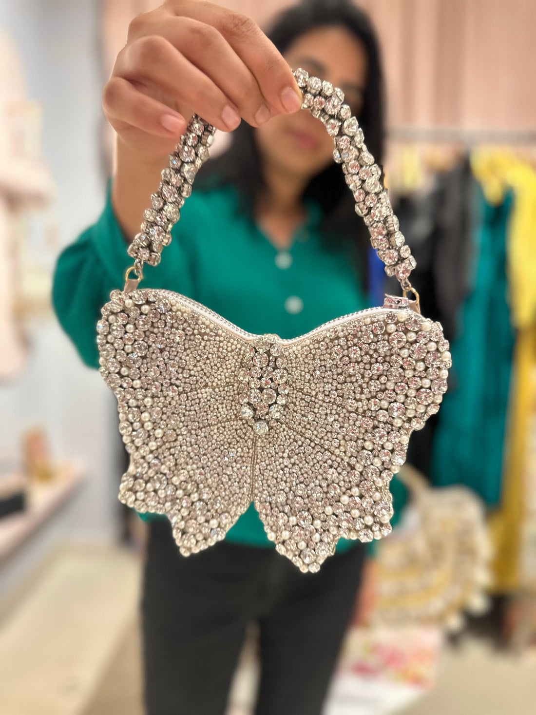 Silver bow-front mini bag with crystal embellishments and chain handle — Ozel