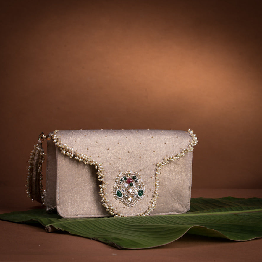 Jadau flap bag – handcrafted Indian embroidery accessory by Ozel