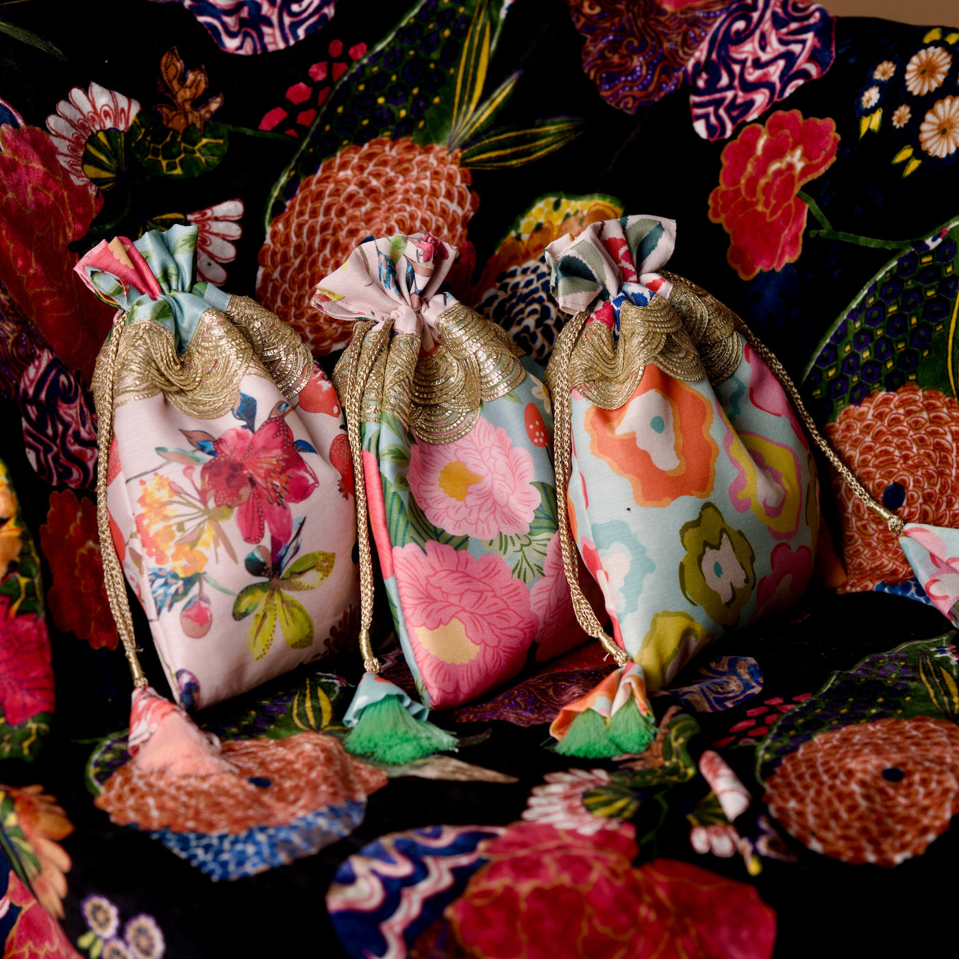 Set of three pastel floral print drawstring potli bags — Ozel
