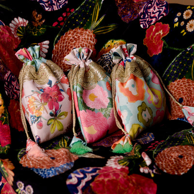 Set of three pastel floral print drawstring potli bags — Ozel