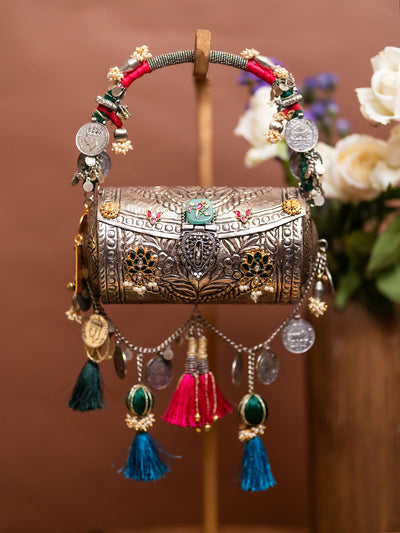 Tara silver-plated tribal handbag held by model — Ozel
