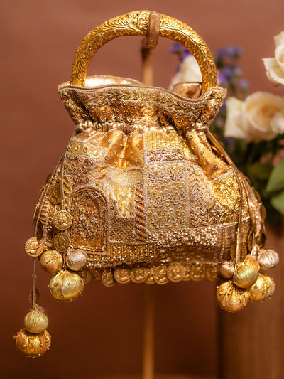 Detail of Abha hasli beige potli embroidery and tassels — Ozel