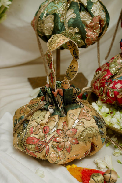 Side view of Kalamkari embroidered gol potli — Ozel