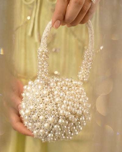 Bijoux nano bag held by model — Ozel