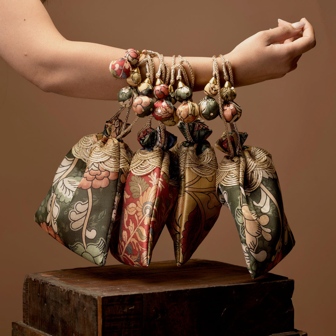 Set of four Kalamkari print bags arranged — Ozel