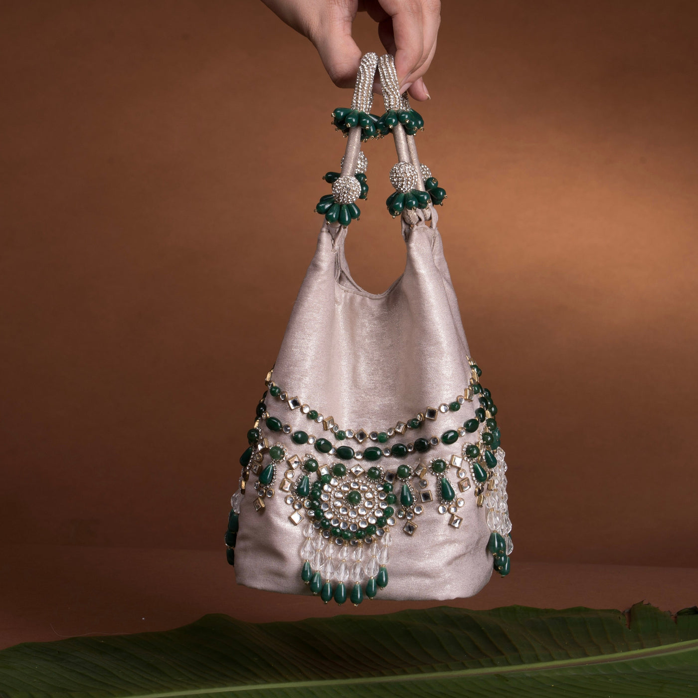 Panna emerald kundan structured bucket bag with gold-plated detailing — Ozel
