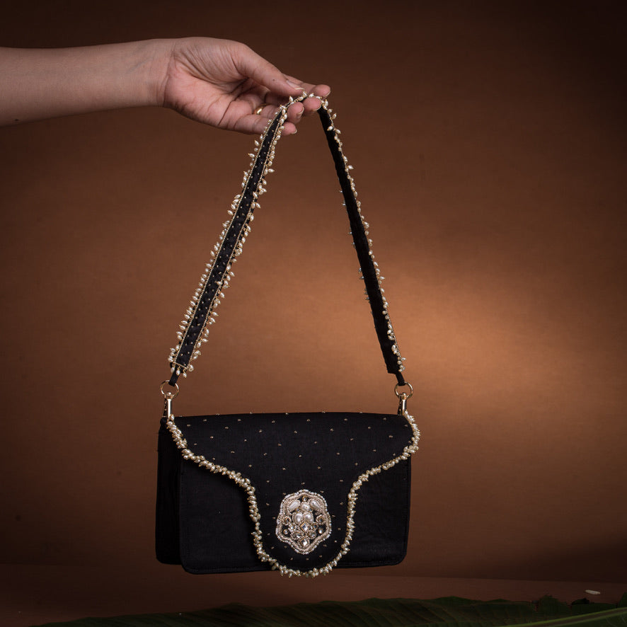 Jadau flap bag – handcrafted Indian embroidery accessory by Ozel