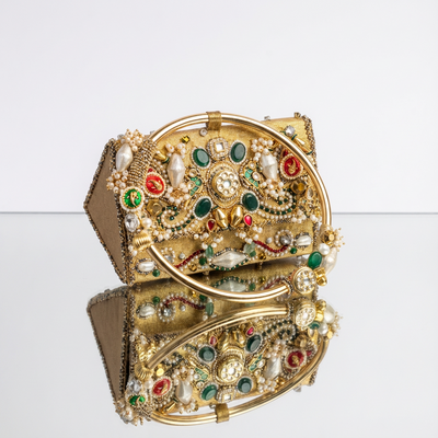 Handcrafted gold zardozi mini bag with pearls, kundan stones and emerald cabochons — Ozel