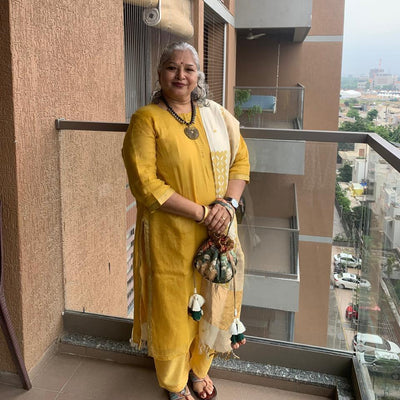 Kalamkari embroidered gol potli styled for festive look — Ozel