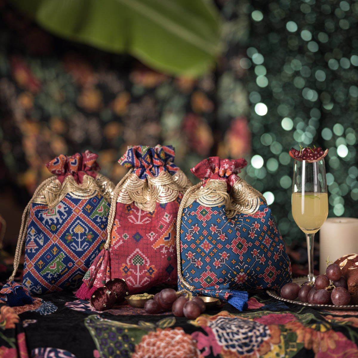 Patola print mulberry art-silk potli detail — Ozel