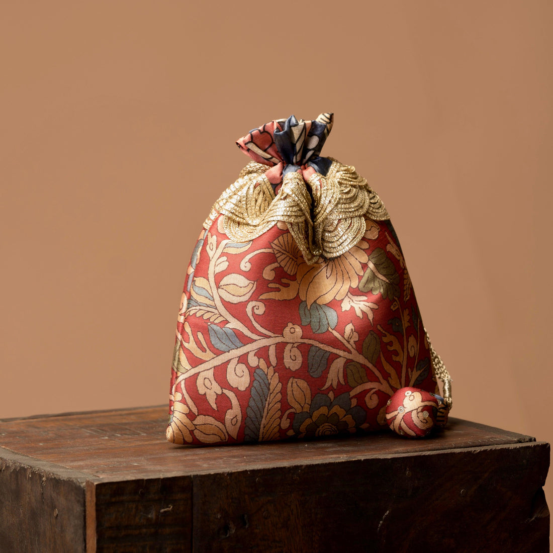 Kalamkari print potli bag styled for wedding favour — Ozel