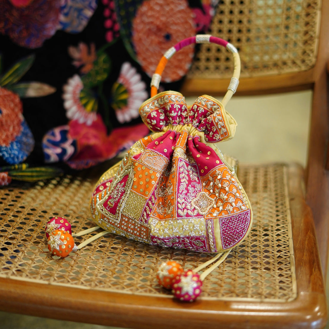 Multicolor patchwork embroidered potli bag with jadau motifs