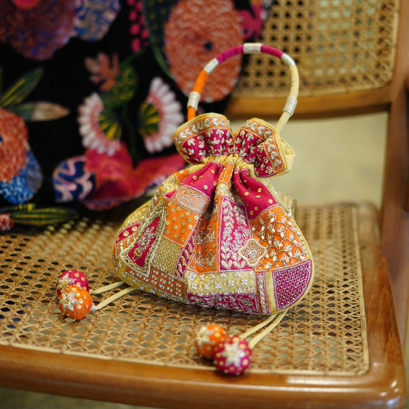 Multicolor patchwork embroidered potli bag with jadau motifs