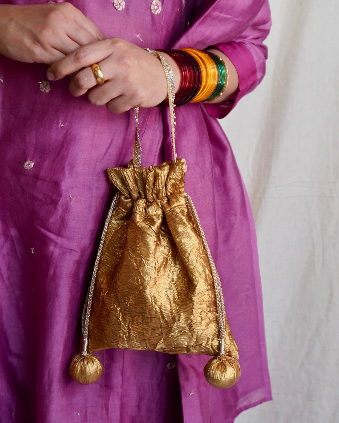 Top view of Nisha gota potli drawstring — Ozel