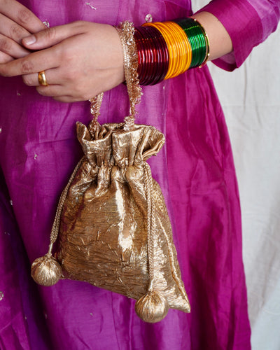 Nisha potli bag tassel detail — Ozel