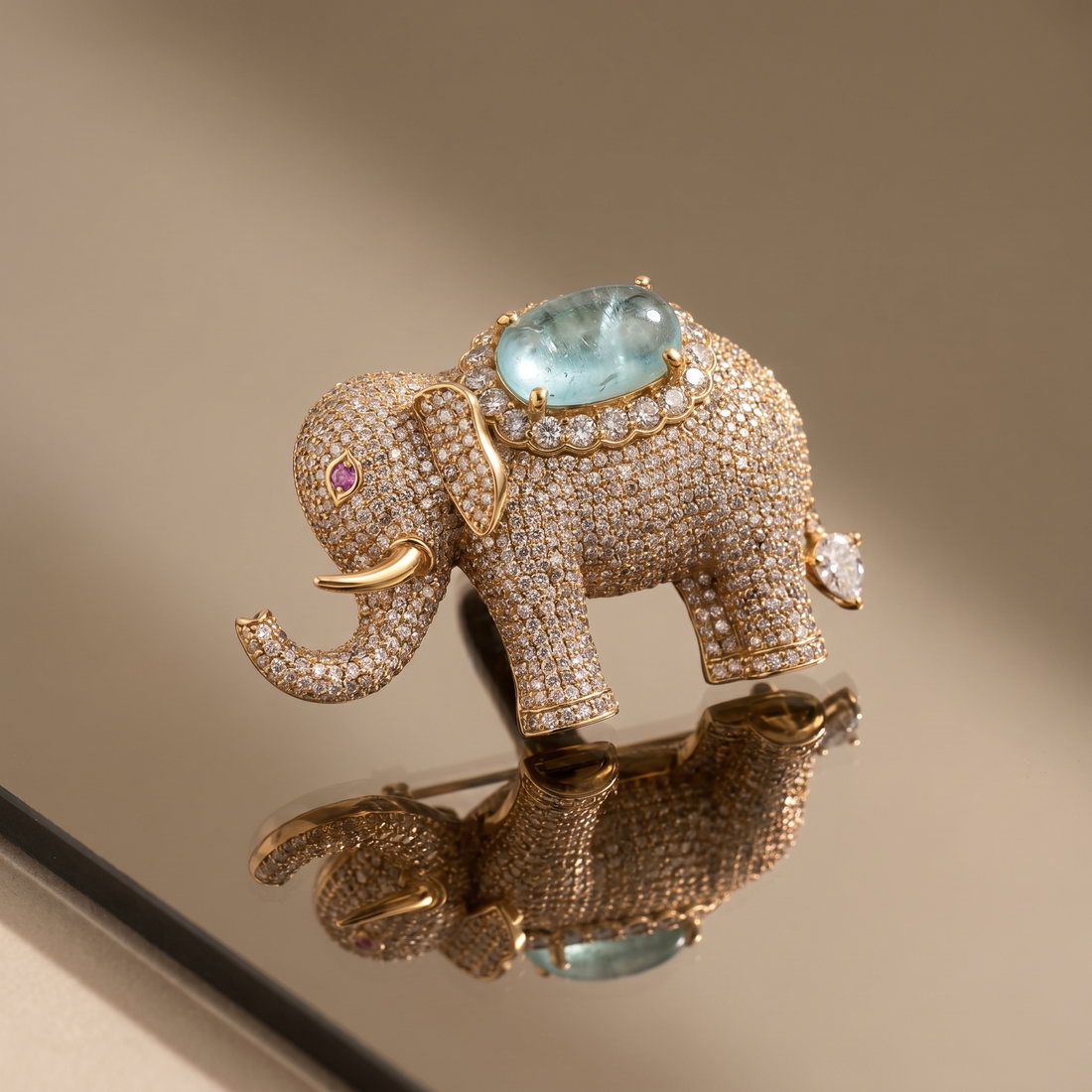 Crystal-studded elephant brooch with aqua gemstone centerpiece — Ozel