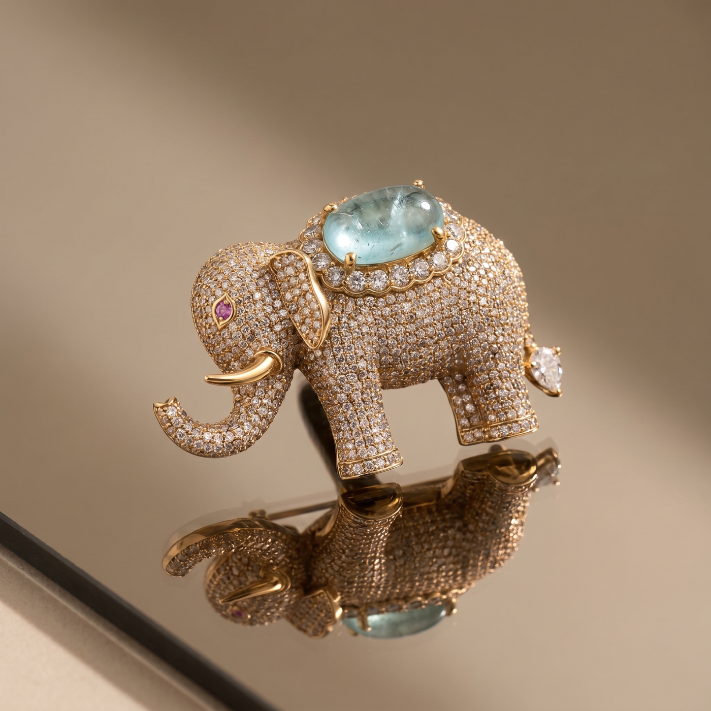 Crystal-studded elephant brooch with aqua gemstone centerpiece — Ozel
