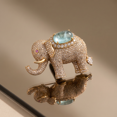 Crystal-studded elephant brooch with aqua gemstone centerpiece — Ozel