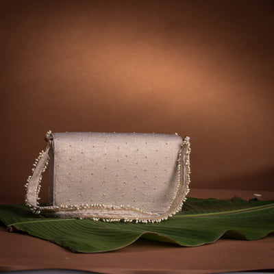 Jadau flap bag – handcrafted Indian embroidery accessory by Ozel