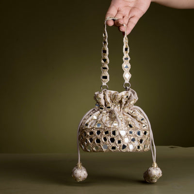 Mirror work bucket bag with shisha embroidery and gold detailing