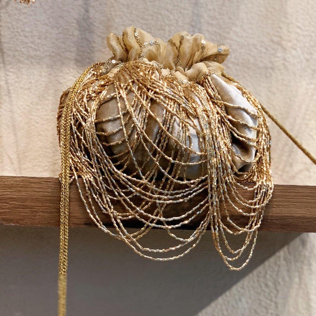 Dragon's Nest embroidered drawstring potli bag with handmade tassels — Ozel