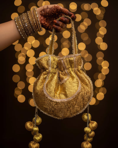 Shashi gold-gota embroidered potli bag with handmade tassels — Ozel