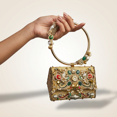 Handcrafted gold zardozi mini bag with pearls, kundan stones and emerald cabochons — Ozel