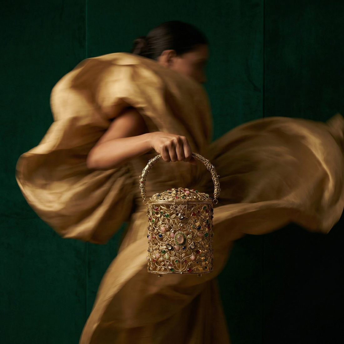 The Ozel filigree bag held by model — Ozel