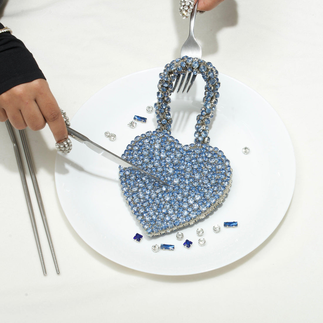 Rhinestone heart mini bag held by model — Ozel