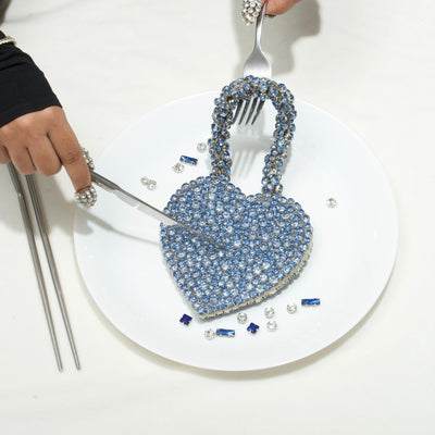 Rhinestone heart mini bag held by model — Ozel